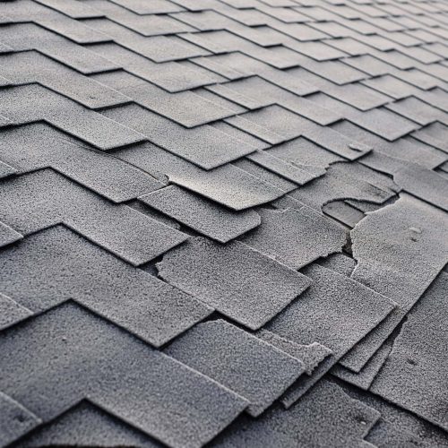 Close up view on Asphalt Roofing Shingles Background. Roof Shingles - Roofing. Shingles roof damage covered with frost
